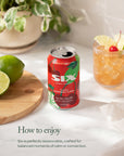 Six cherry lime can on a table with a drink of cherries and limes
