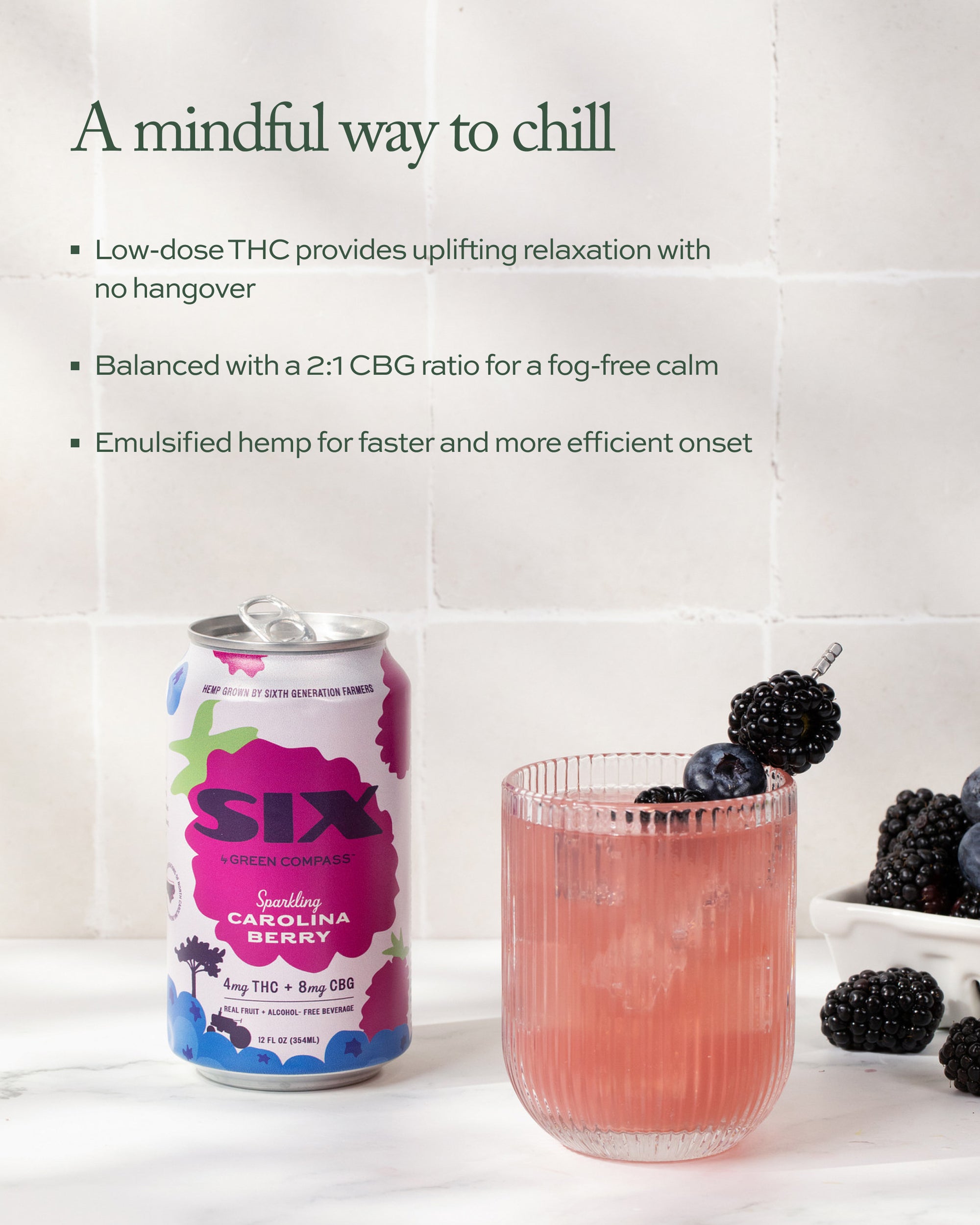 SIX sparkling cannabis berry can with a glass and blackberries on a white marble surface against a tiled background