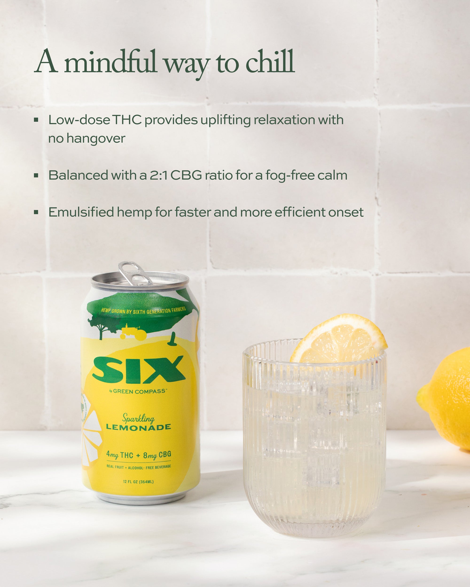 Can of SIX sparkling lemonade with a glass of lemonade six sparkling lemondare and lemon slices on a white background