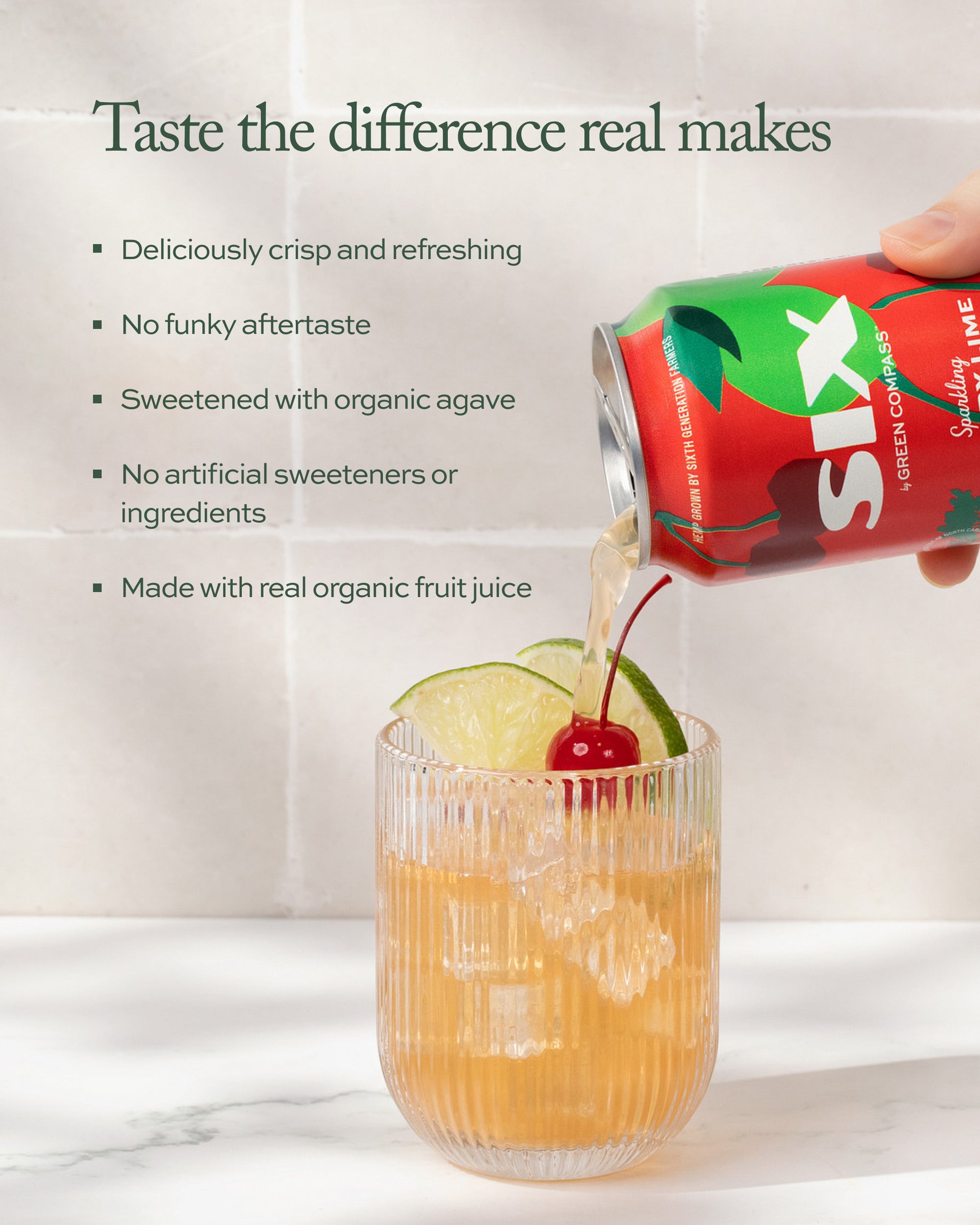 Cans of a beverage being poured into a glass with lime and cherry garnish