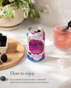 Can of Six sparkling carolina berry drink on a table with a glass and blackberries