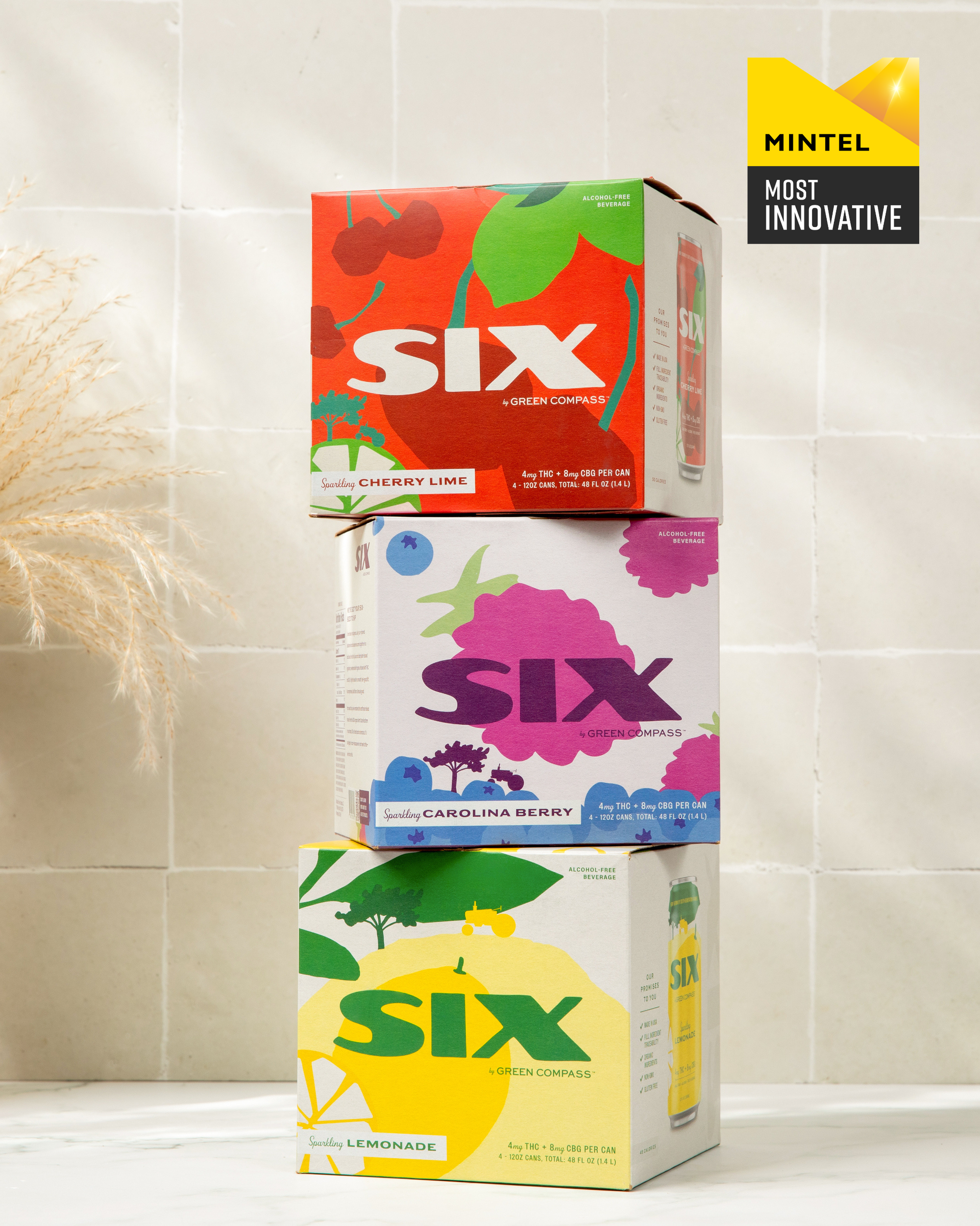 Three boxes of SIX drinks stacked on a tiled surface with a badge in the top right corner displaying a mintel most innovative award